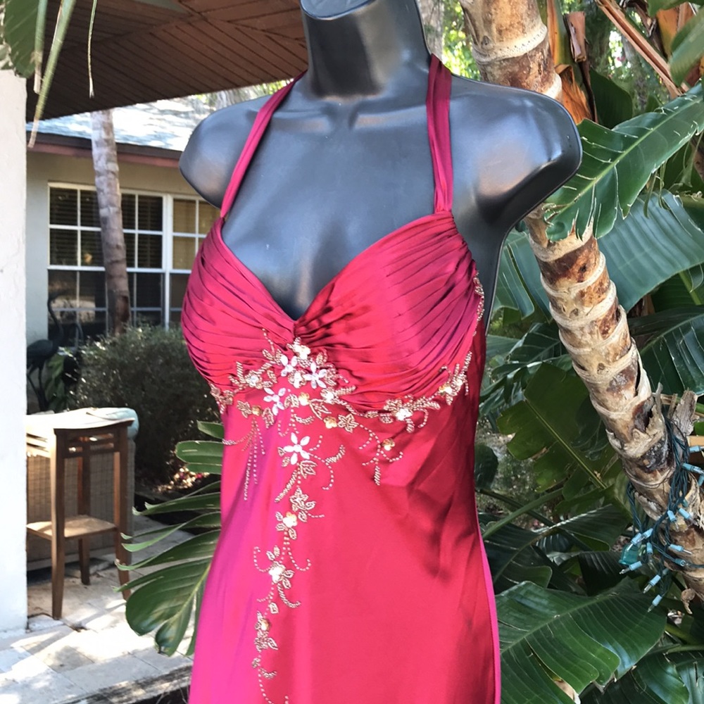 Beaded and backless satin halter gown